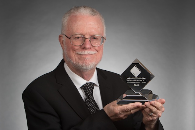 Dan Dugan holding CAS award.